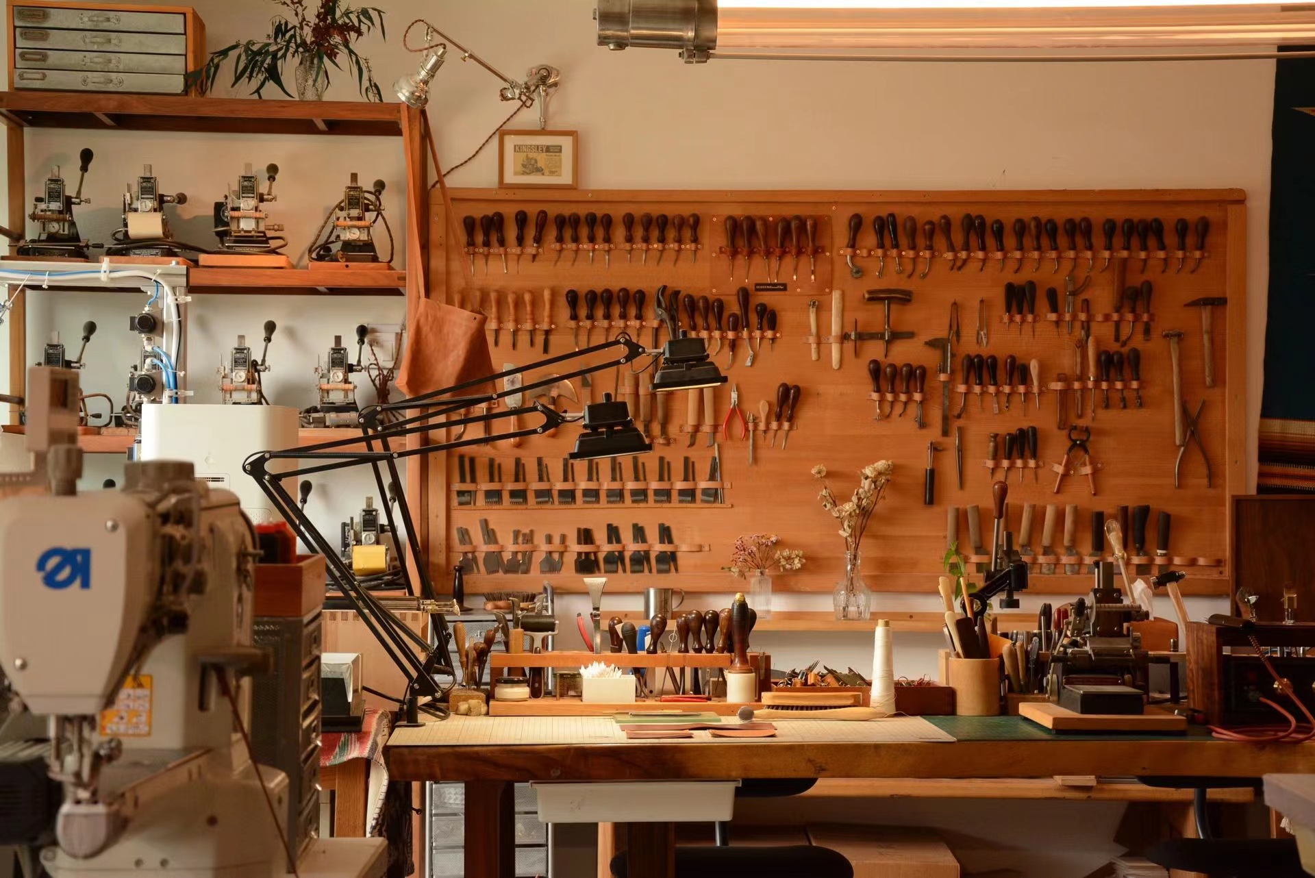Leather goods workshop tools and stitching station